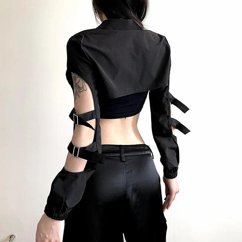 The back view of a black cropped cyberpunk cardigan, showcasing a sleek high-neck design and edgy cut-out details for a futuristic goth look.