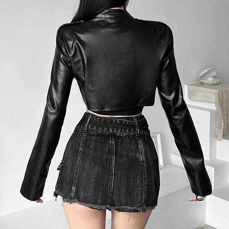 The back of a black faux leather cyberpunk-inspired jacket, featuring a slim-fit design and a high-fashion cropped cut.