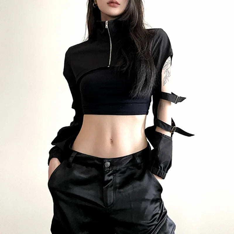 A black cropped cargo cardigan with striking hollow-out accents, a body-hugging fit, and a front zipper, embodying cyberpunk rebellion.