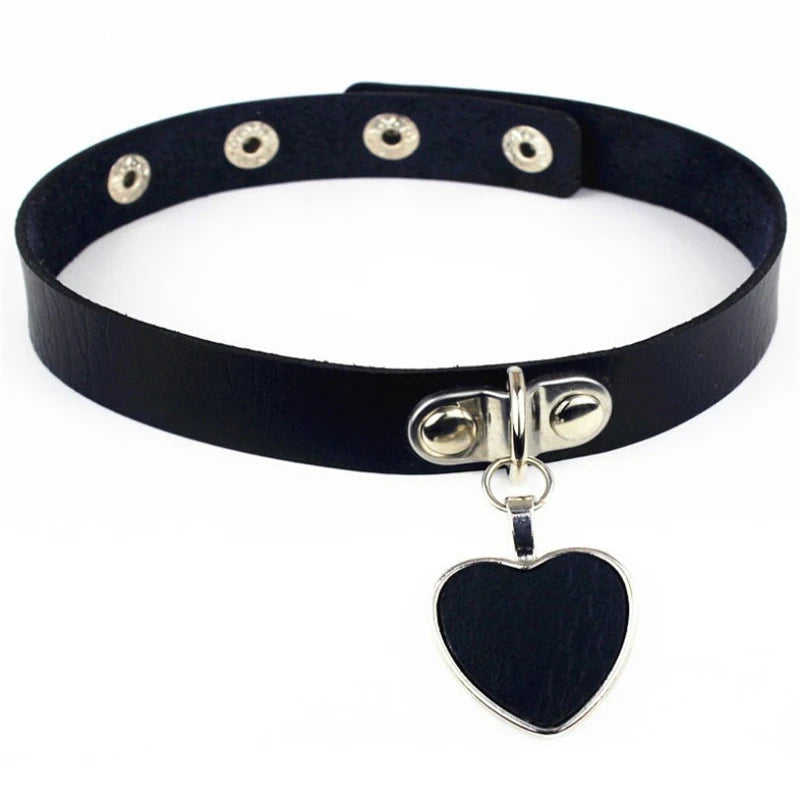 A black leather choker featuring a striking black metal heart at the center, blending gothic elegance with punk rebellion. Perfect for alternative fashion lovers.