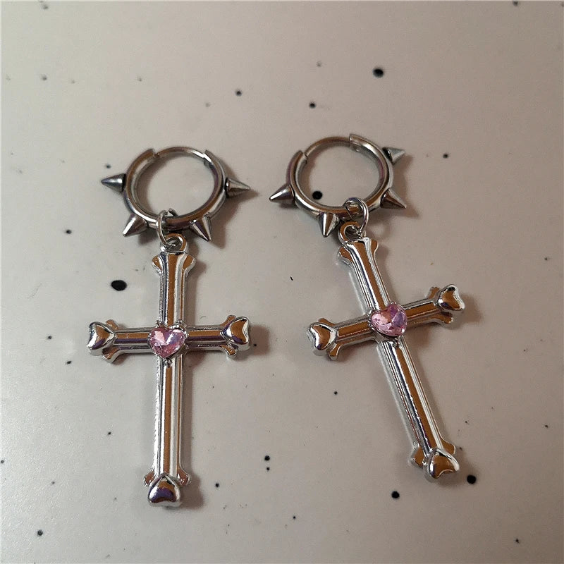 Close-up of gothic bone cross earrings, perfect for punk and emo fashion.