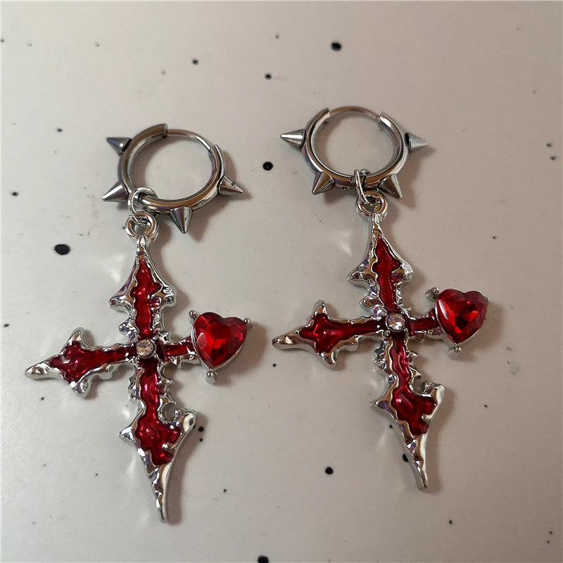 Close-up of Red Glass gothic cross earrings with 