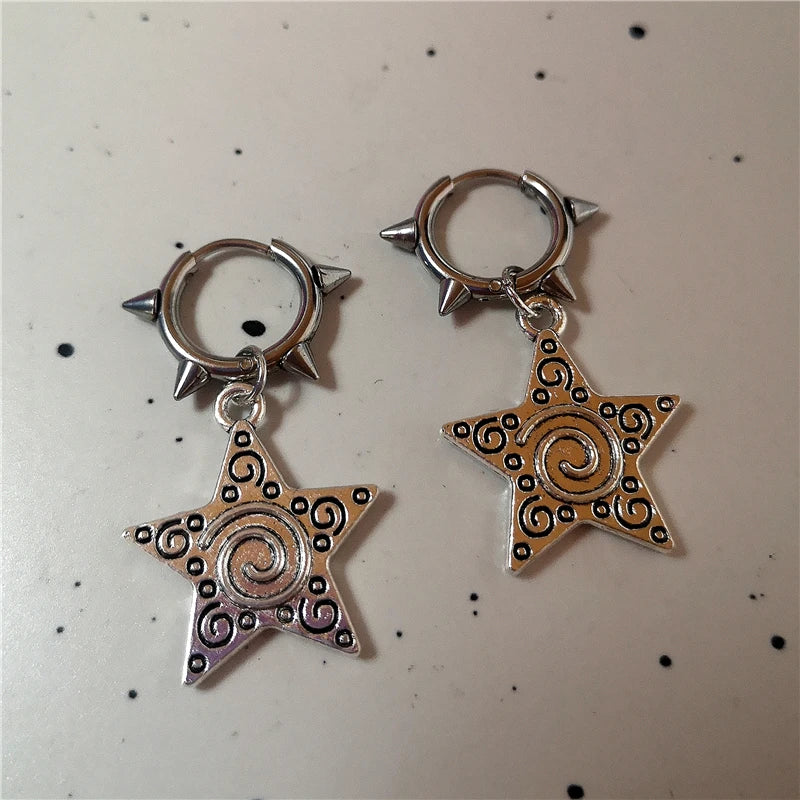 Close-up of gothic star earrings, adding a mystical touch to any outfit.