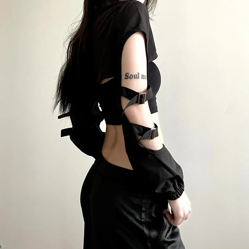 A side view of the cropped black gothic cardigan, highlighting the long sleeves, hollow-out details, and fitted silhouette for a cyberpunk-inspired aesthetic.