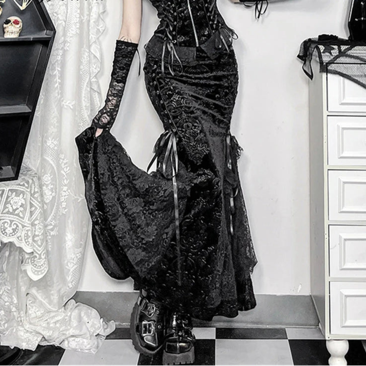 A gothic black mermaid skirt with jacquard floral texture, lace patchwork, and a dramatic flared hem.