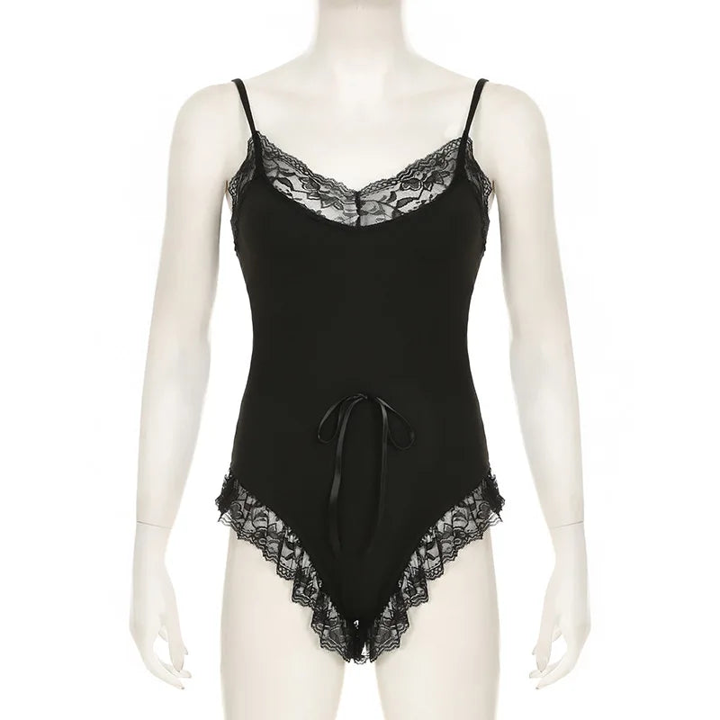 Front view of the Dark Fairy Lace Bodysuit, showcasing its sheer lace patchwork and delicate bow detail