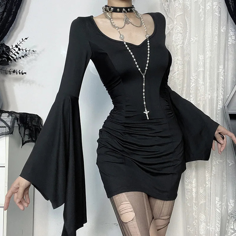 Side profile of the Midnight Enchantress Batwing Sleeve Mini Dress, highlighting the pleated detailing and flowing sleeves